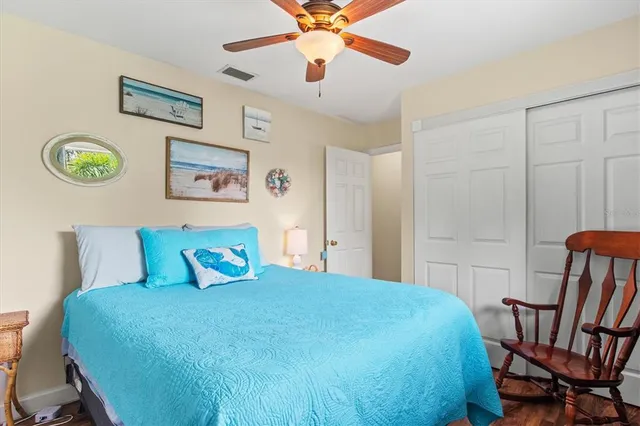a workspace with wooden floor and windows