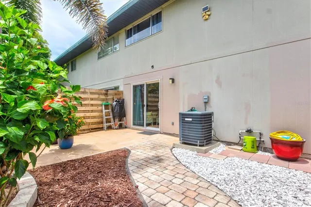 a view of a garden with a house