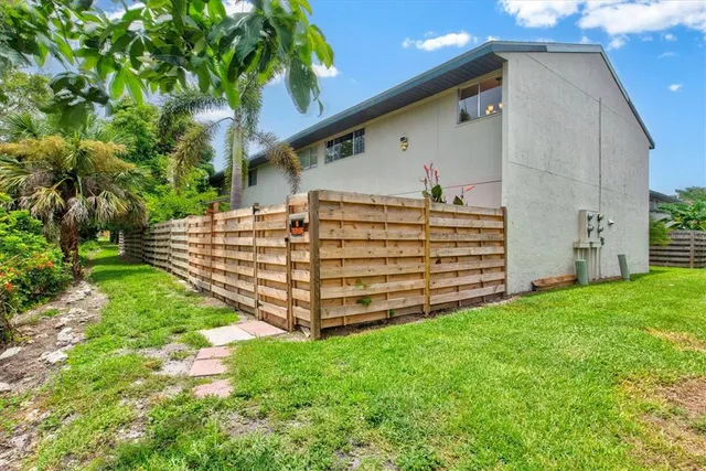 a view of a yard with a tree