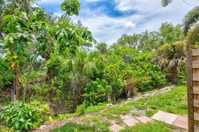 an aerial view of a house with swimming pool garden and lake view