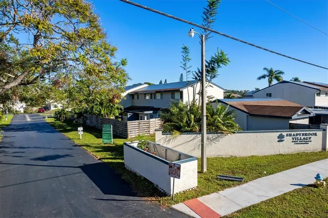 a kitchen with cabinets and white appliances