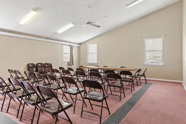 a front view of house with yard and outdoor seating