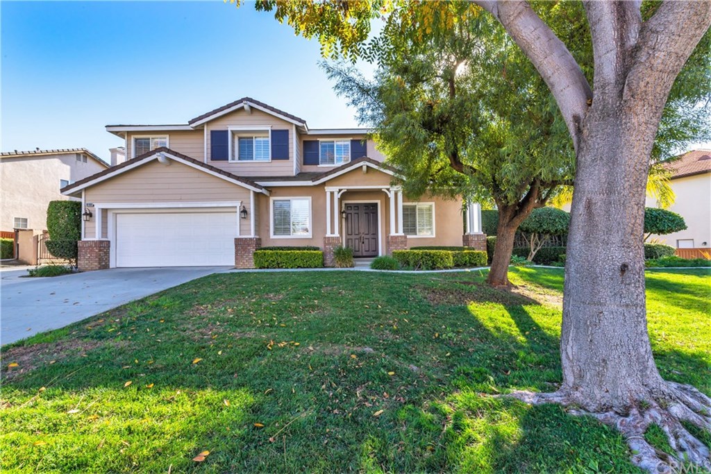 19189 Buckboard Lane Riverside, CA 92508 - Photo 1 of 1 a front view of a house with garden