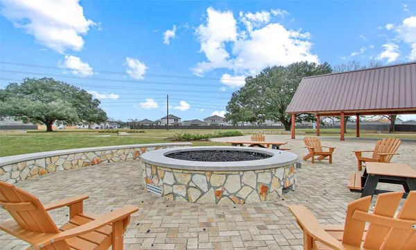 a open kitchen with stainless steel appliances granite countertop a stove a sink and dishwasher a oven with the view of city