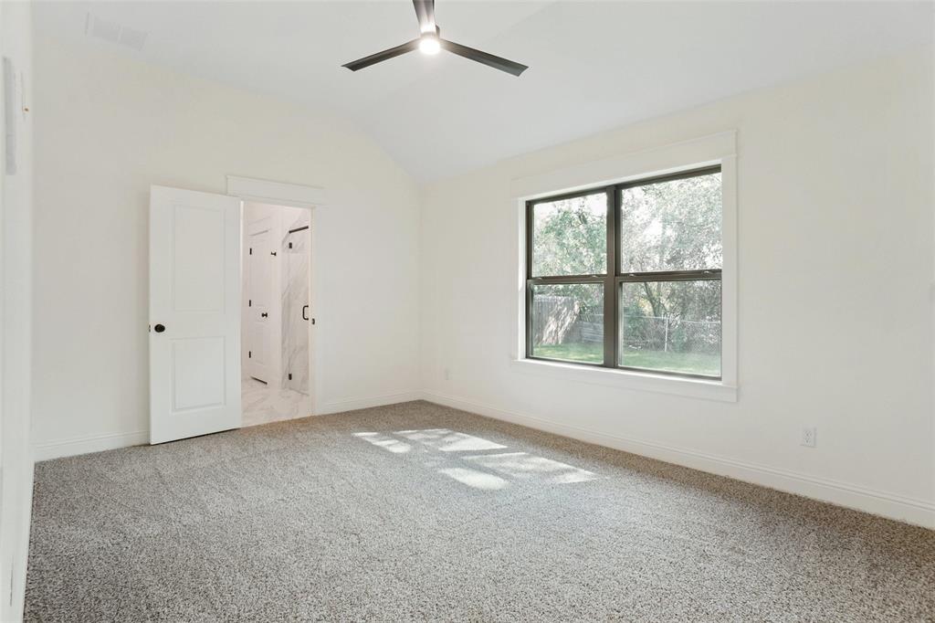 107 South 6th Street Godley, TX 76044 - Photo 10 of 21 an empty room with windows and closet