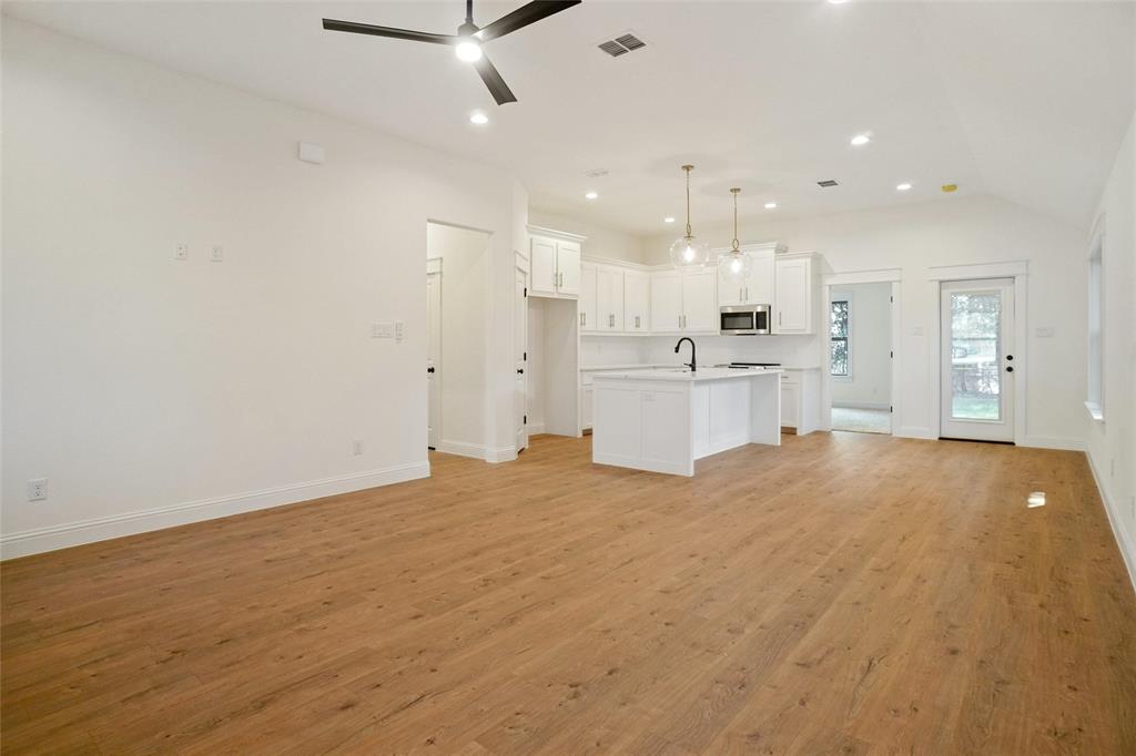 107 South 6th Street Godley, TX 76044 - Photo 20 of 21 a large room with kitchen view and living room view