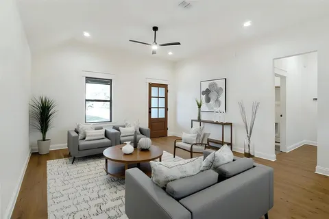 a kitchen with kitchen island a sink stainless steel appliances and cabinets