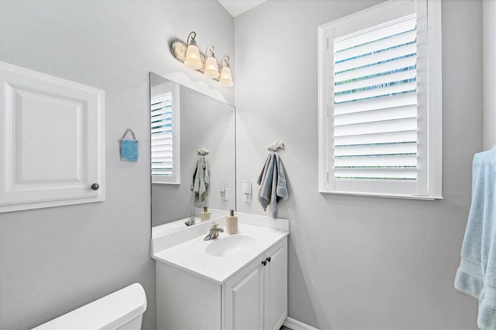 4 Windward Way Placida, FL 33946 - Photo 31 of 39 a bathroom with a toilet a sink and a mirror