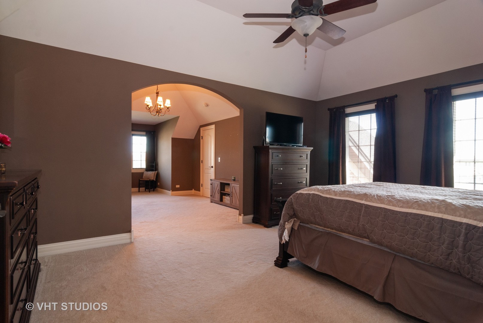770 Merrill New Road Sugar Grove, IL 60554 - Photo 14 of 31 a spacious bedroom with a bed and a chandelier
