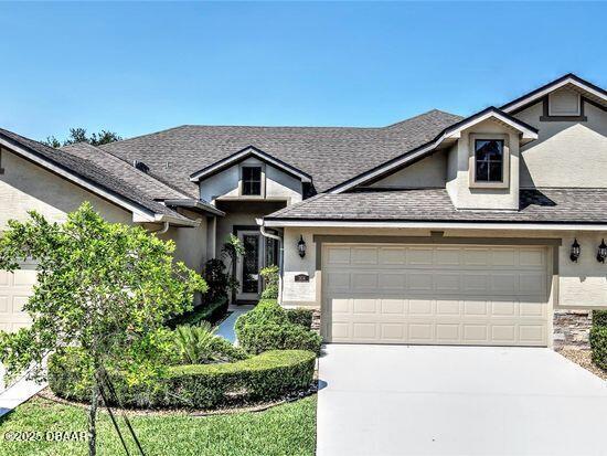 1312 Hansberry Lane Ormond Beach, FL 32174 - Photo 1 of 31 a front view of a house with a yard
