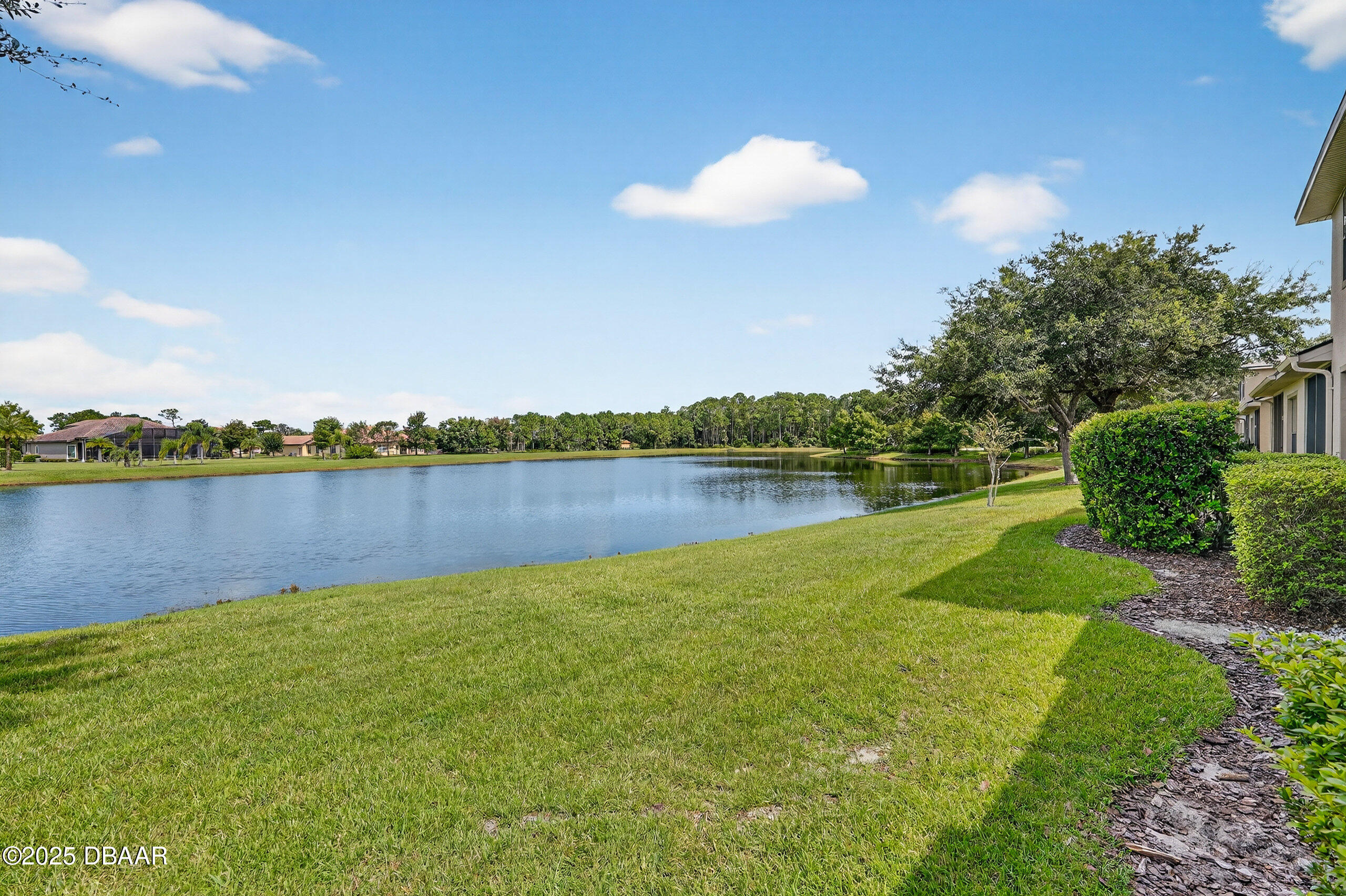 1312 Hansberry Lane Ormond Beach, FL 32174 - Photo 30 of 31 a view of a lake with houses in the back