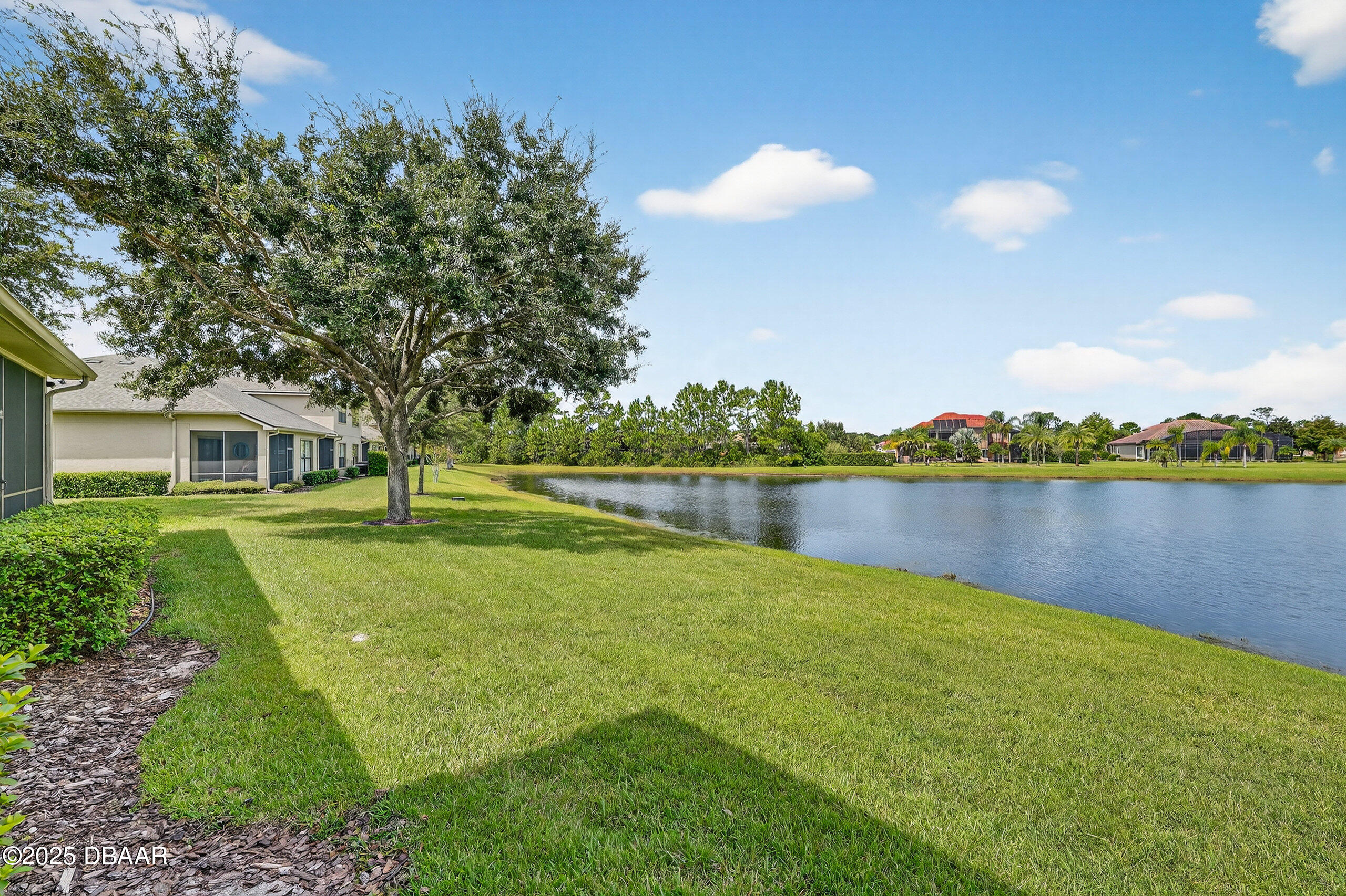 1312 Hansberry Lane Ormond Beach, FL 32174 - Photo 31 of 31 a view of a house with a yard and a lake view