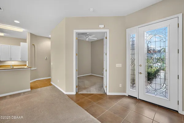 a view of a house with a yard and a lake view