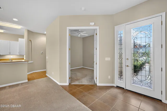 a view of a house with a yard and a lake view