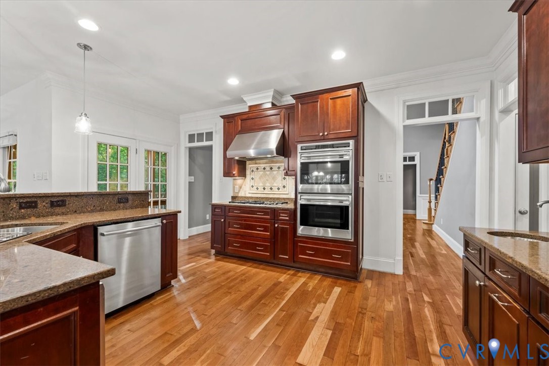 3308 Yarding Way Toano, VA 23168 - Photo 33 of 83 a kitchen with stainless steel appliances granite countertop a stove and a refrigerator