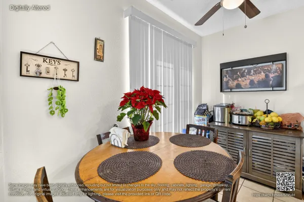 a dining room with furniture and potted plants