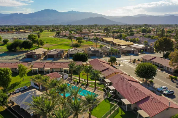 an aerial view of residential houses and outdoor space