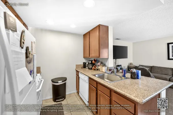 a bathroom with a granite countertop sink a mirror and a toilet
