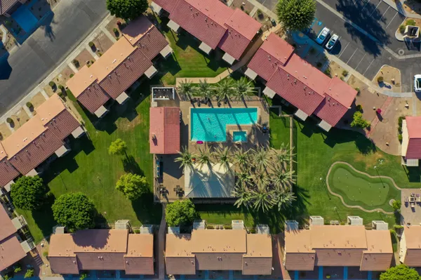 an aerial view of a houses with street