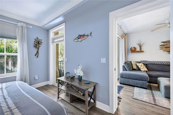 a bedroom with furniture and a window