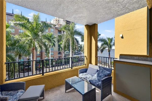 a view of balcony with furniture