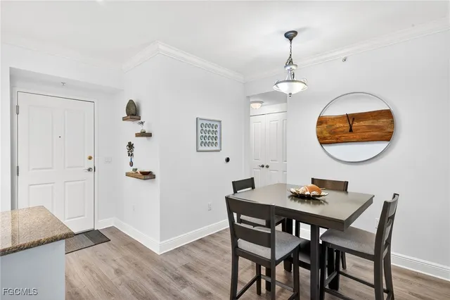 a view of a dining room with furniture and chandelier