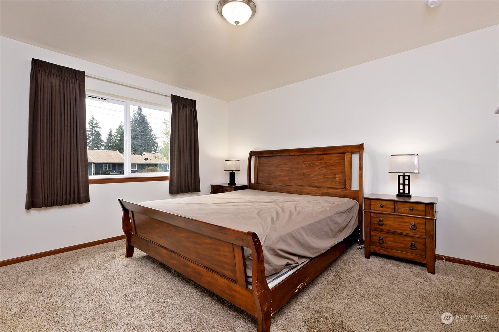 1025 Connection Street Shelton, WA 98584 - Photo 11 of 21 a bed sitting in a bedroom next to a window