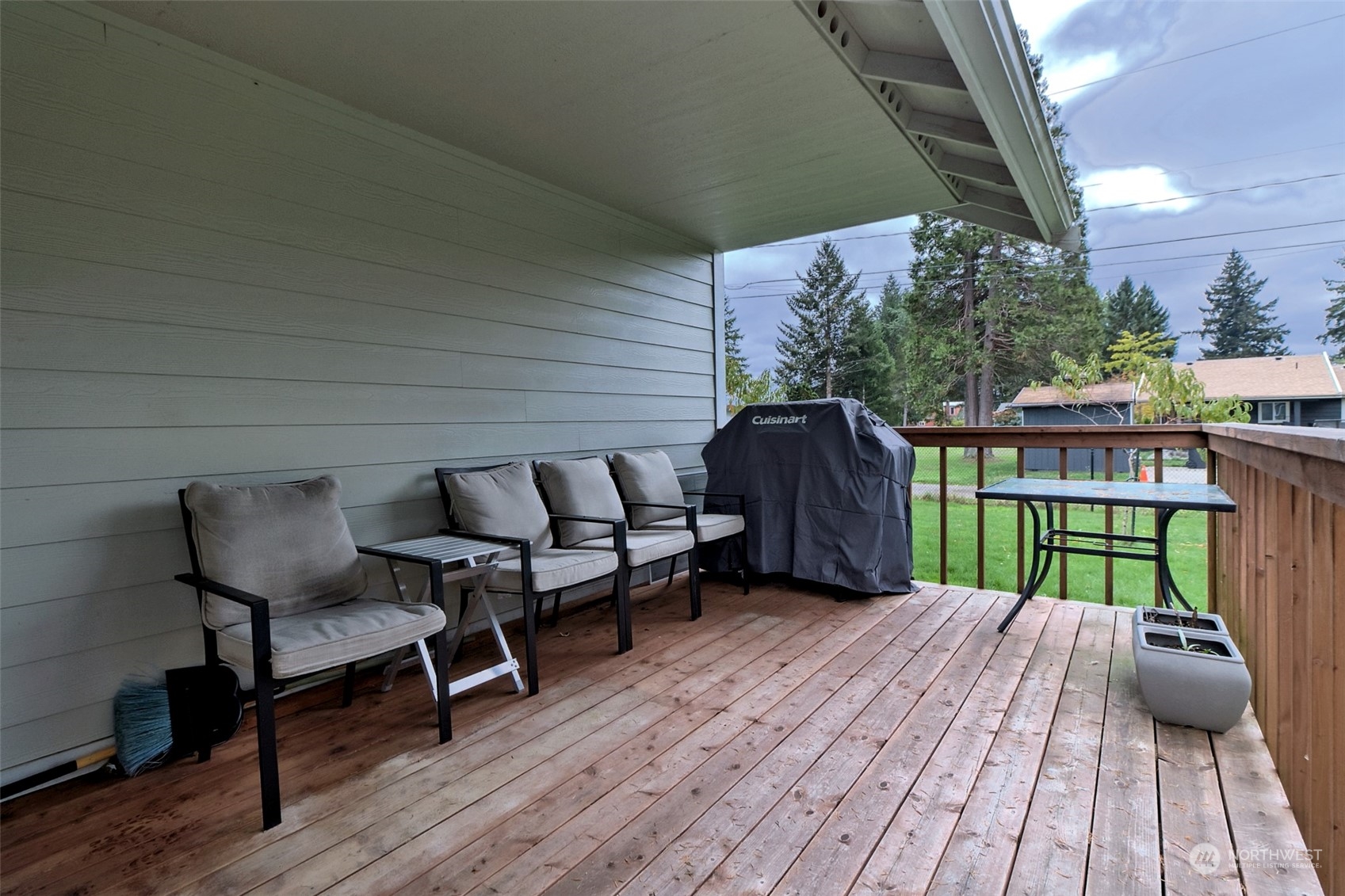 1025 Connection Street Shelton, WA 98584 - Photo 19 of 21 a balcony with wooden floor table and chairs