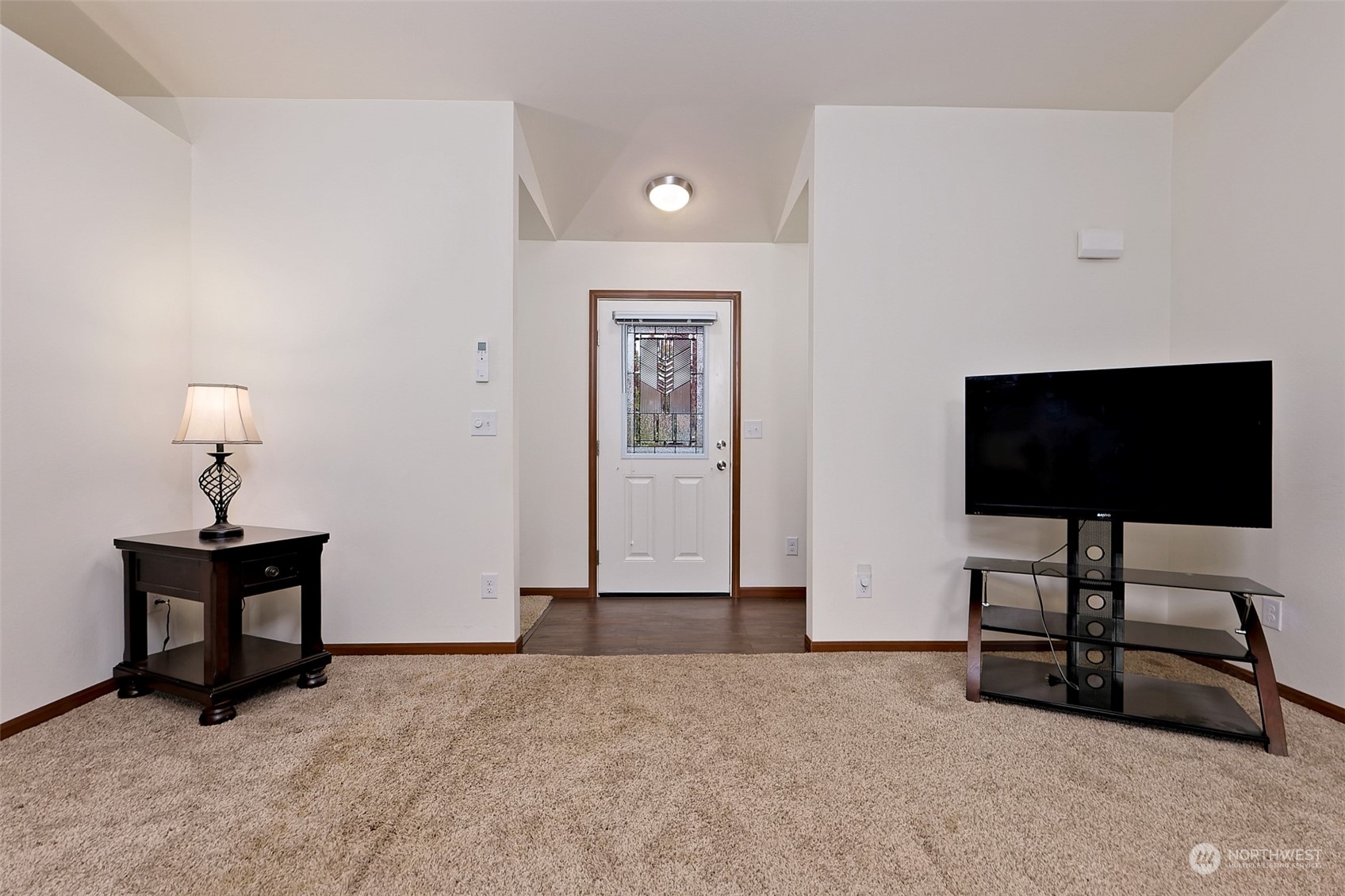 1025 Connection Street Shelton, WA 98584 - Photo 4 of 21 a living room with furniture and a flat screen tv