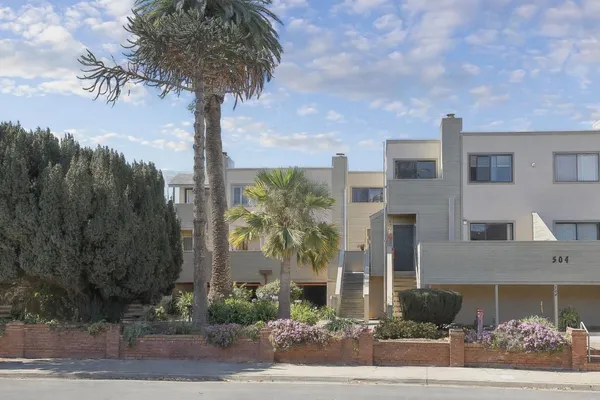 a front view of a building with street view