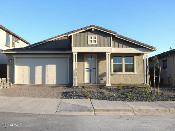 a front view of a house with garage