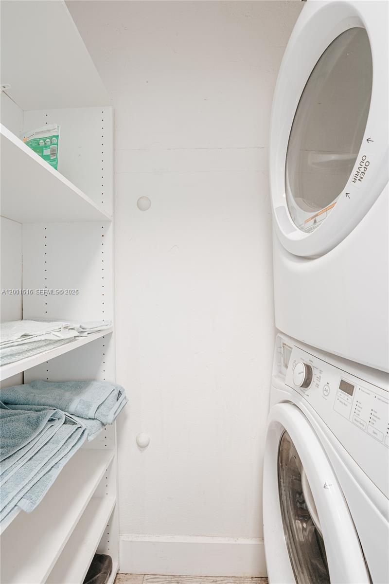 1340 Lincoln Road, Unit 805 Miami Beach, FL 33139 - Photo 12 of 21 a view of a bathroom with washing machine and a sink