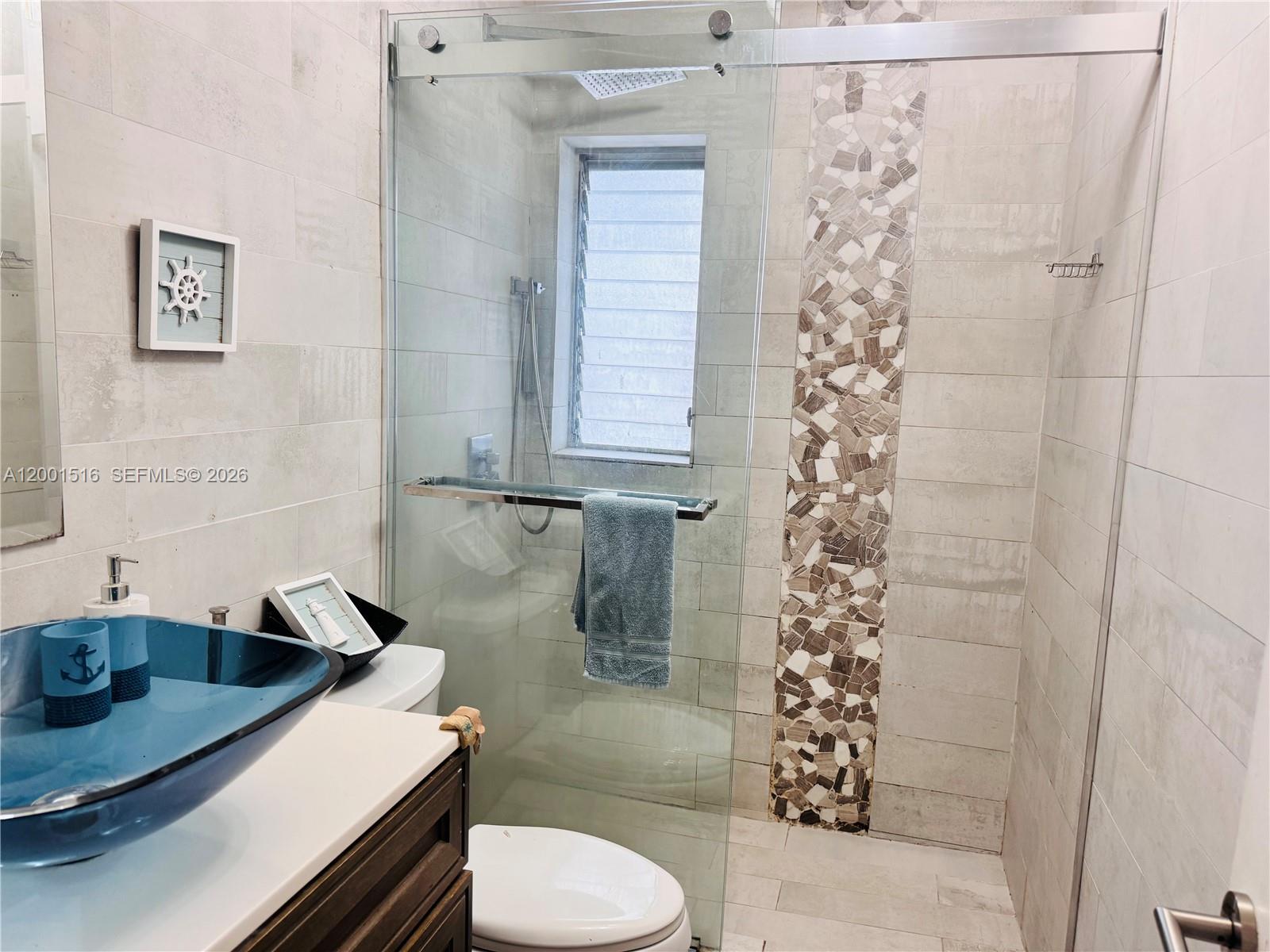 1340 Lincoln Road, Unit 805 Miami Beach, FL 33139 - Photo 15 of 21 a bathroom with a sink toilet and shower
