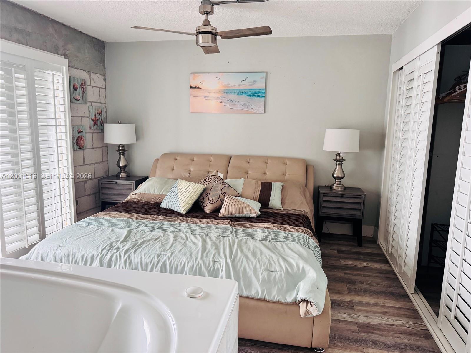 1340 Lincoln Road, Unit 805 Miami Beach, FL 33139 - Photo 20 of 21 a bedroom with a bed and a walk in closet