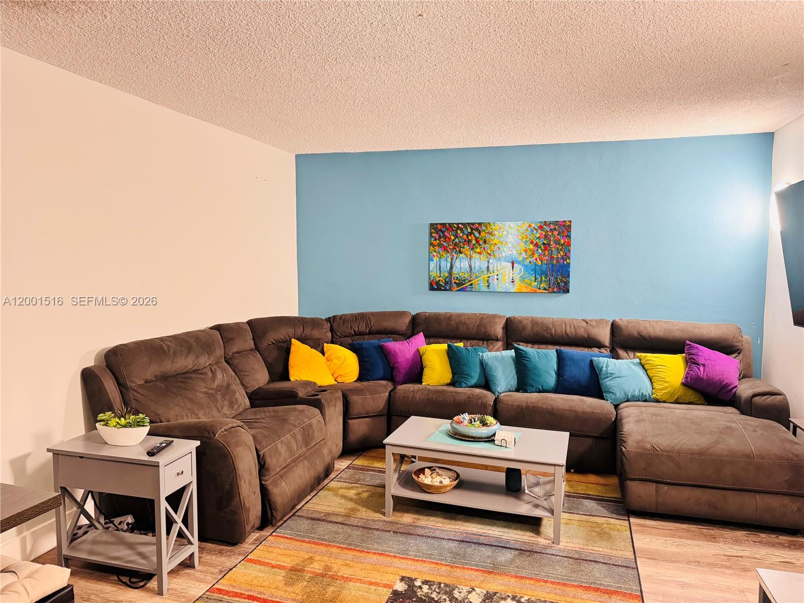 1340 Lincoln Road, Unit 805 Miami Beach, FL 33139 - Photo 7 of 21 a living room with furniture and a couch