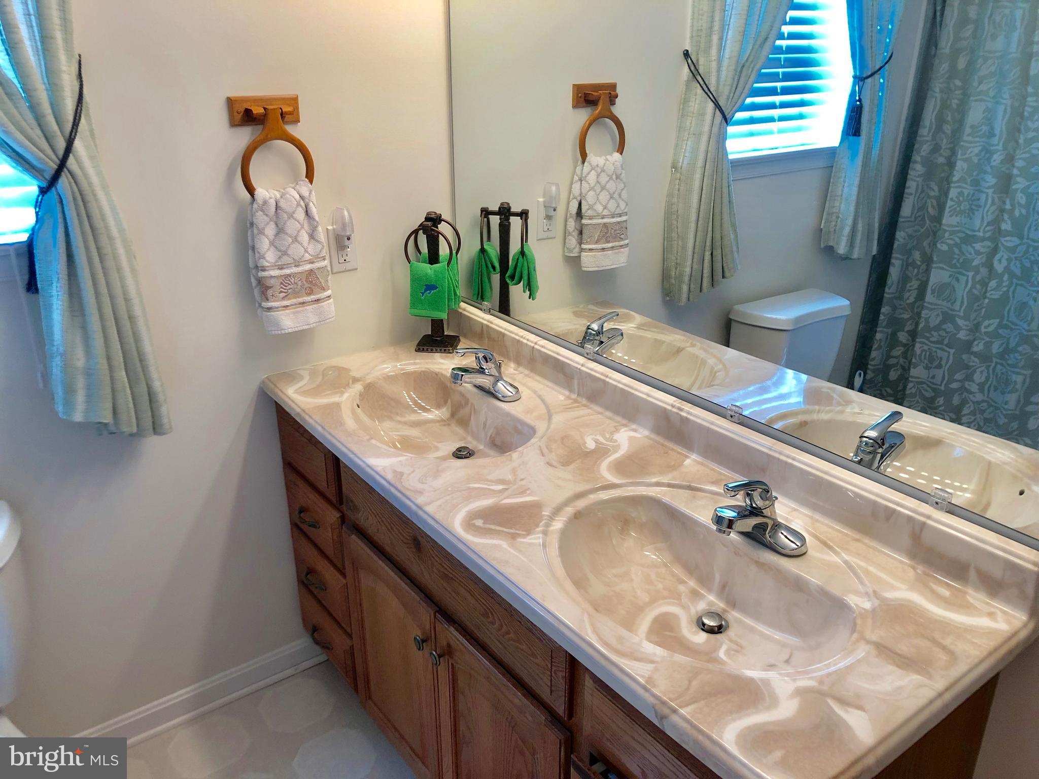 49898 Airedele Road Ridge, MD 20680 - Photo 15 of 30 a bathroom with a sink and a mirror