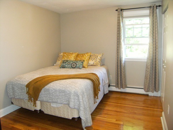 6 Gerald Road Framingham, MA 01701 - Photo 14 of 20 a bedroom with a bed and wooden floor