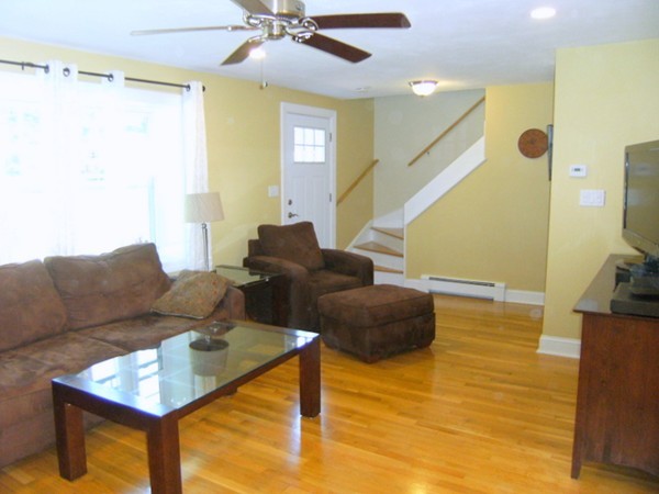 6 Gerald Road Framingham, MA 01701 - Photo 5 of 20 a living room with furniture and a flat screen tv