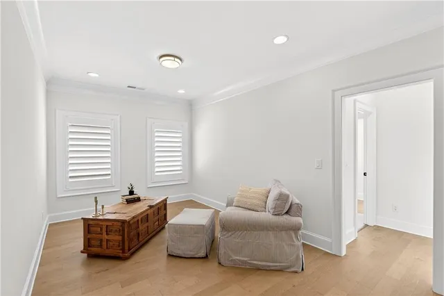 a spacious bedroom with a bed and window