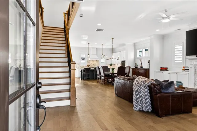 a living room with furniture fireplace and flat screen tv