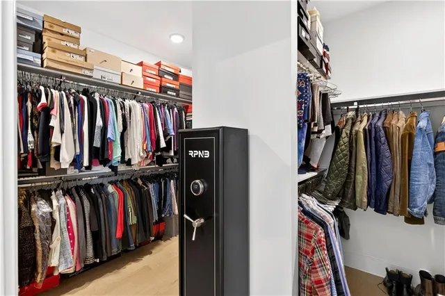 a bathroom with a sink a toilet a tub and shower