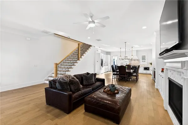a living room with furniture fireplace and a television