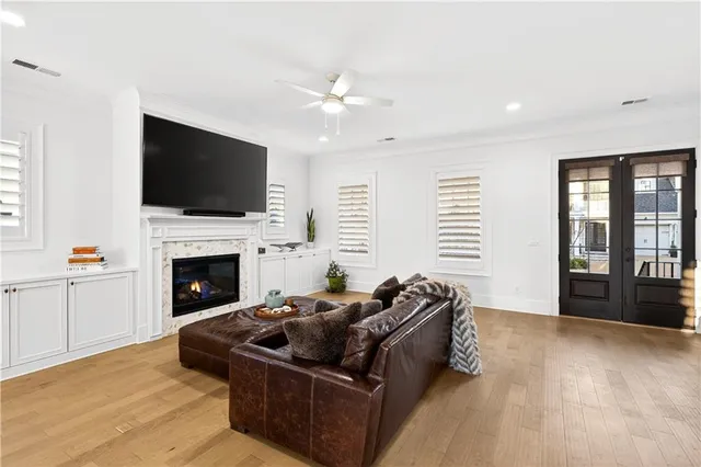 a dinning area with furniture and wooden floor