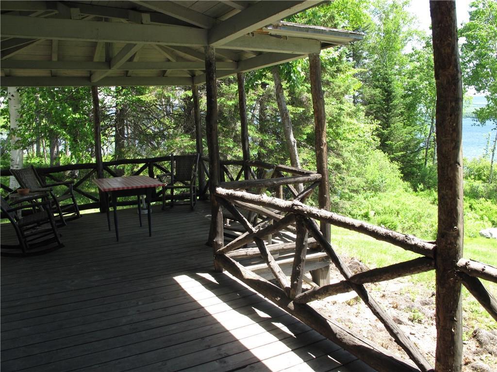 281 Bonney Point Road Rangeley, ME 04970 - Photo 24 of 34 Classic covered porch with split railing