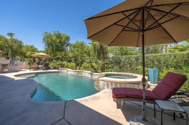 a view of a swimming pool with a patio