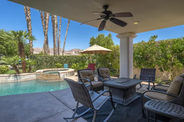 a view of a patio with couches chairs and a table