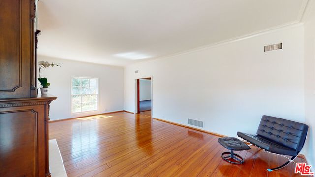 an empty room with a yard and empty shelves