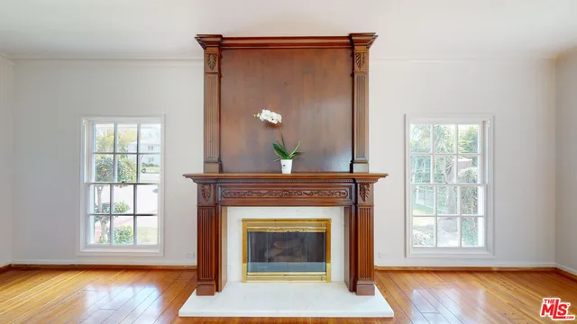 a large kitchen with a sink and stainless steel appliances