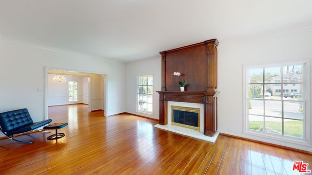 a kitchen with stainless steel appliances granite countertop a refrigerator a stove and a sink