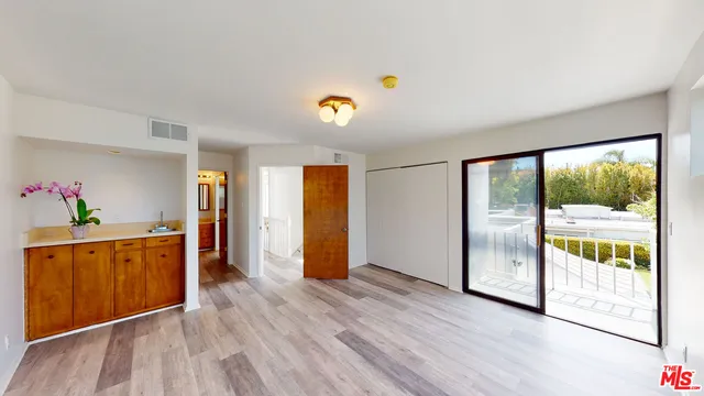 a view of a back yard with a street